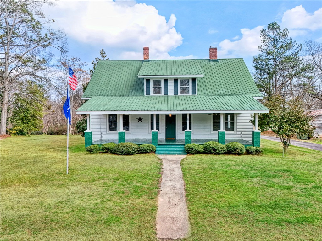 This charming home offers a welcoming facade with