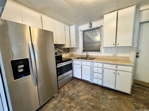 Photo of 86-313 Puhawai Road, Waianae, HI 96792 (MLS # 202614430)