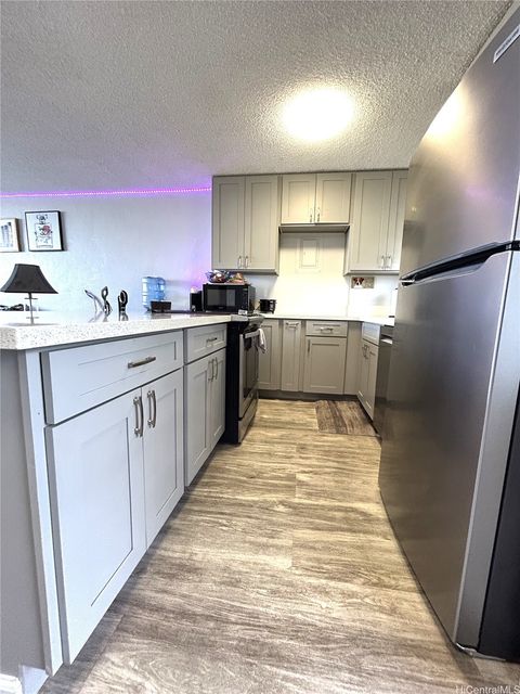 Photo of 98-719 Iho Place #5-1404, Aiea, HI 96701 (MLS # 202608061)