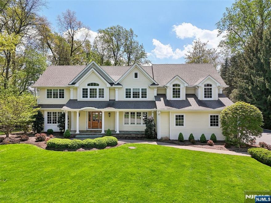 Masterfully renovated and expanded (2003) entertainer's dream home designed by Petrillo Architects and nestled on 0.87 acres of resort-like grounds. Attention to detail at every turn of the interior, highlighted by an open-concept, vaulted ceilings, and hardwood floors throughout. At the heart of the home, the eat-in kitchen boasts high-end appliances, a fireplace, an oversized center island, butler & walk-in pantries and connection to the great room with exposed beams & fireplace. Enjoy easy access to the backyard with extensive architectural landscaping, a 20 x 44 gunite pool & spa, built-in grilling station, and expansive patios. Four bedrooms including the primary suite with tray ceiling, office, walk-in closet and a spa-like bath. Finished walk-out basement includes a gym, rec room and office. Spacious mudroom with built-ins and ample storage, double washer/dryer, lofted play room above the 3-car garage with EV charger, Andersen windows - all situated on a private cul-de-sac!