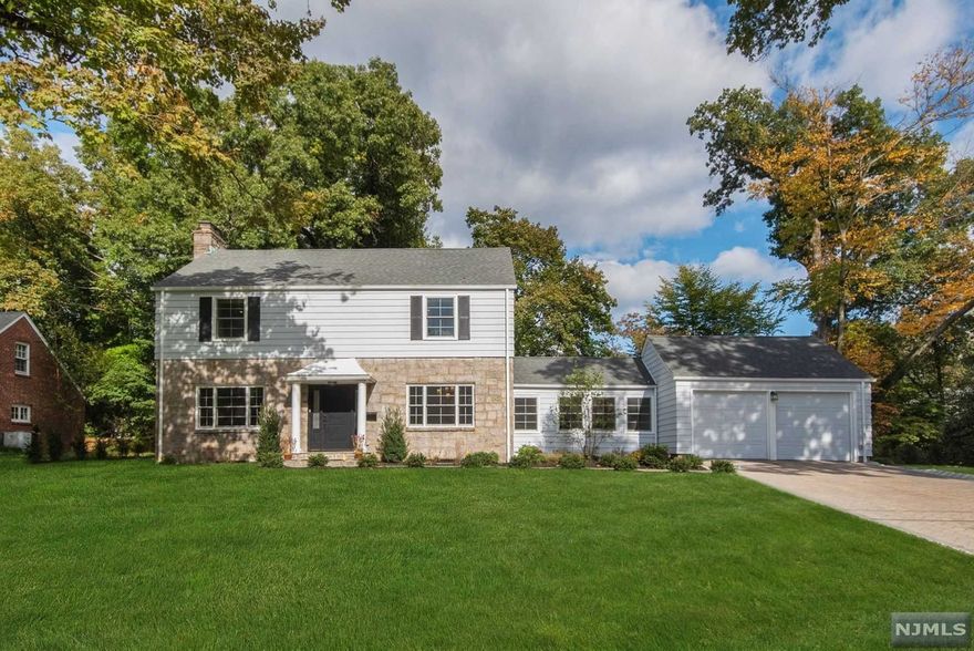 Gut renovated from top to bottom! Beautiful, modernized traditional gem in the heart of the prestigious East Hill of Tenafly features an open custom chef's kitchen complete w/stainless steel appliances, stunning Caesar stone countertops & customized banquette seating. Open sun-filled dining room to host all your friends & family. Spacious formal living room with wood burning fireplace w/access to the outdoors, expansive first floor bedroom and full bath overlooking the impeccably landscaped backyard. The main floor has an additional modern powder room for convenience. Second floor boasts a spacious primary suite and 2 additional sun filled bedrooms & large full bath w/double vanities. Finished basement w/ full bath & open bonus space. 2 car garage w/ new mudroom. All new custom closets throughout, hardware, solid doors, windows, plumbing and electric. Steps from David Johnson Park, Blue Ribbon School, Transpo to NYC, houses of worship and downtown Tenafly.