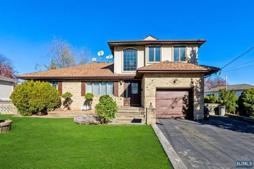 Welcome to this gorgeous 2,300 SF home that comes with so many amenities. The first floor features a massive living room, large dining area, gorgeous kitchen, a separate party/entertainment room, 2 large bedrooms, 2 bathrooms, a fireplace over a stylish brick wall, and sliders to a raised concrete patio. The second floor is an addition with 2 bedrooms. One being the master bedroom suite that has a jacuzzi, marble bath and a stand in shower. Being a corner lot this house has a large backyard and plenty of room for BBQs, parties and all kinds of entertaining. Also being so close New York commuting becomes a breeze.