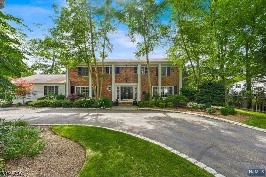 When a lovely setting & prime location top your list, look no further than this classic "coventry" center-hall colonial. Resting on lush grounds w/ gorgeous landscaping, curb appeal is only the beginning. Inside you are greeted by a double door entry to the foyer, leading to the elegant spacious main living area. Bright sundrenched spaces & neutral decor welcome the opportunity to entertain. You'll find gleaming wood floors w/ classic base & crown moldings throughout the main living space. A wood-burning fireplace anchors the great room, in addition to a gas fireplace in the formal living room. The incredible kitchen lies beyond the formal dining room & great room w/ custom cabinetry, granite counter, SS appliances, a generous 2 tier center island w/ separate breakfast area, sliders to the patio, inground heated pool plus a generous backyard. A laundry room, powder room, home office w/ built-ins, 1 bedroom and a full bath complete the main level. The upper level features 4 bedroom