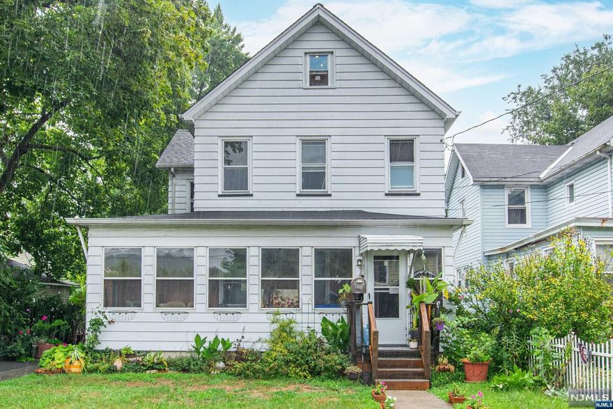 Opportunity awaits in the heart of Bloomingdale with this custom colonial home located in a quiet neighborhood. As you step through the enclosed front porch, you are welcomed by the warmth of hardwood floors throughout. The living room features exquisite custom woodwork & custom shelving with exposed brick, & it shares a double-sided fireplace with the formal dining room, creating a cozy & elegant atmosphere. The kitchen boasts a center island, double sink & pantry, while a convenient powder room/ laundry room completes the first level. Upstairs, the second floor offers a primary bedroom, two additional bedrooms, & a main bath. The third floor presents a huge bonus room, perfect for a variety of uses. Outside, enjoy the expansive fenced-in backyard & the convenience of a two-car detached garage with a second-story loft. This home offers both charm & modern amenities in a desirable location. Close to restaurants, shops & transportation.