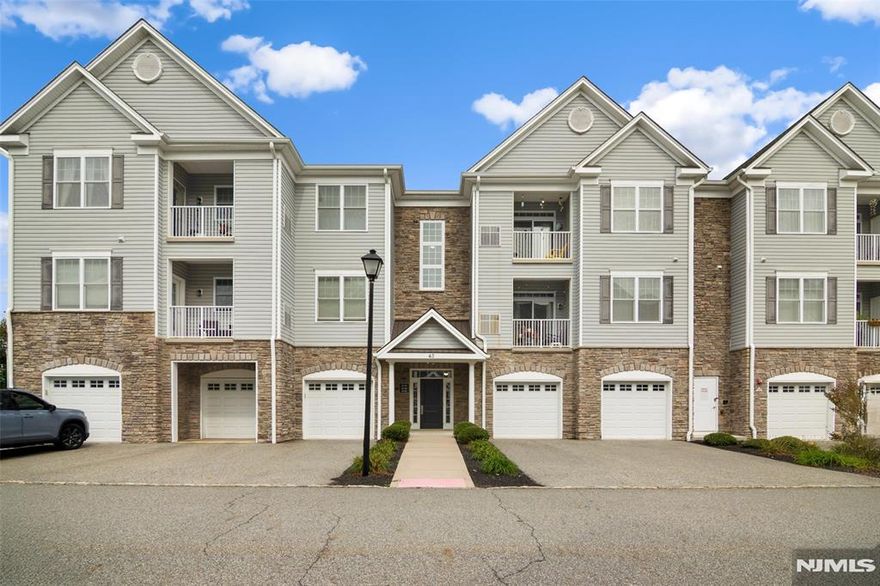 Welcome to Lakeland Village! This spacious 2-bedroom, 2-bath condo offers over 1,300 sq. ft. of contemporary comfort within a beautifully maintained community built in 2016. The open-concept design with high ceilings creates a bright, airy atmosphere, seamlessly connecting the living, dining, and kitchen areas perfect for both everyday living and entertaining. The modern kitchen features granite countertops, stainless steel appliances, and abundant cabinetry. Additional highlights include an in-unit washer and dryer, central air, a private outdoor space, a roomy garage with driveway parking, and a separate storage closet. Ideally located near shopping centers, dining, parks, and major highways, Lakeland Village offers the perfect balance of convenience and tranquility. Move-in ready and immaculate, this home is ready to welcome you just unpack and enjoy.