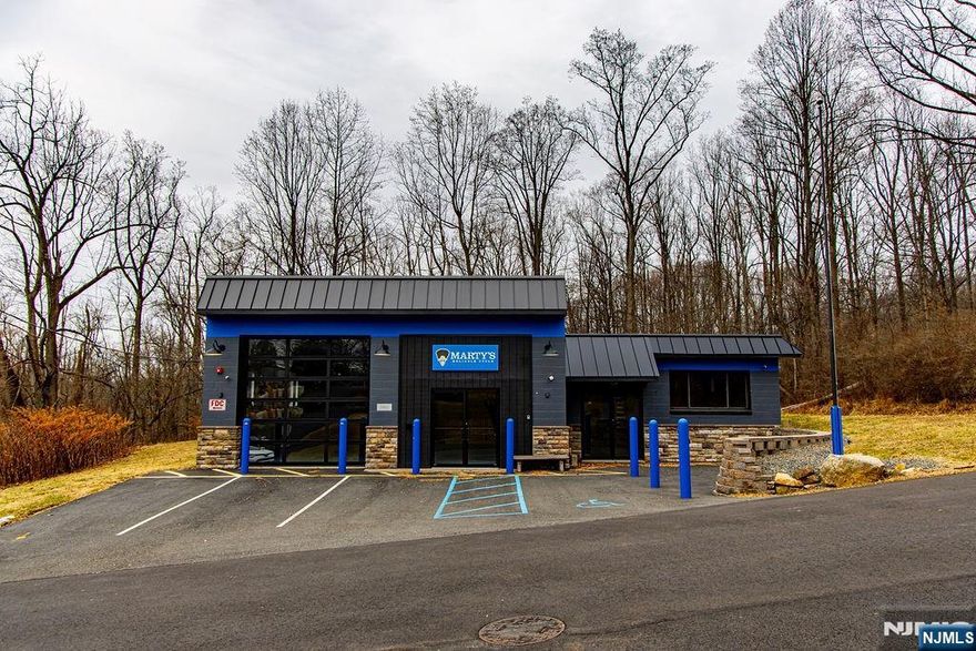 Fully renovated 3,800 SF free-standing commercial building for lease in downtown High Bridge. Features approx. 12â€™ ceilings, all-new systems, sprinklered interior, updated electric, extensive security cameras, and flexible open layout. Garage door has bluetooth controls. Cameras are wired throughout. Baseboard heat. New, efficient Ductless split cooling units. Currently outfitted with a back office and kitchenette. Building equipped with a comprehensive compressed air distribution system. Located on a 0.34-acre lot in the Downtown Business Zone with multiple permitted uses including retail, office, medical, studio, and mixed-use. Turnkey opportunity in a prime Main Street location.