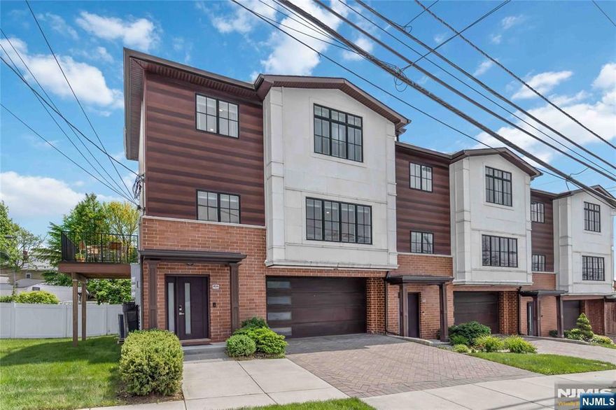 This beautifully maintained 3-bedroom, 2.5-bath corner townhome offers the perfect blend of modern design and everyday comfort. Built just six years ago, the home features 9-foot ceilings, crown molding, and an open-concept layout ideal for todayâ€™s lifestyle. The bright and spacious kitchen is the heart of the home, showcasing quartz countertops, stainless steel appliances, abundant cabinetry, and a generous center island overlooking the living and dining areas. A gas fireplace adds warmth and character to the inviting living space. A convenient powder room complete the main level. Upstairs, the primary suite offers a private retreat with a well-appointed en-suite bath featuring tasteflly selelcted tile in a clean contemporary feel. Two additional bedrooms and a full bath provide comfortable space for family, guests, or a home office. Enjoy the added benefit of a corner location with your own yard and a low-maintenance composite deckâ€”perfect for relaxing or entertaining. Additional highlights include central air, beautiful hardwood floors throughout and a 2-car garage. Ideally situated near restaurants, shopping, and NYC transportation, this home offers both convenience and a sought-after location. Move right in and enjoy modern townhome living at its best!