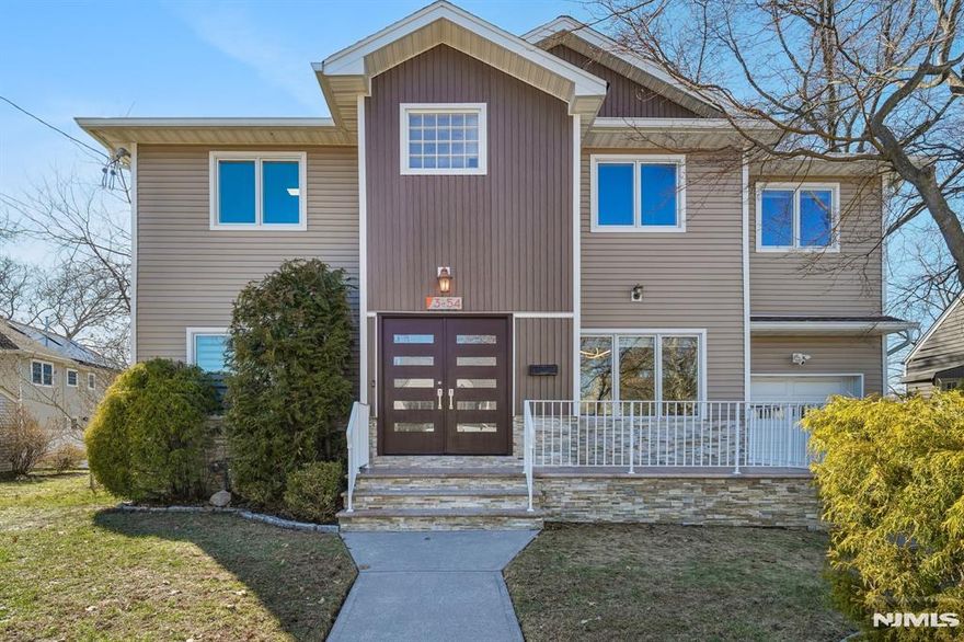 Amazing location in much sought after Gregory Park in Fair Lawn! This 10-year-young 5BR, 3.5BA Center Hall Colonial backs directly to the park and playground and is within walking distance to zoned schools in a highly rated district. Commuters will love the easy access to an express bus and two NJ Transit train stations to NYC (local & express), plus convenient shopping, golf, hiking, and lakes nearby. The first floor offers a bedroom ideal for guests, while the second level features four bedrooms and a laundry room. The primary en-suite includes a spa-like bath with a jetted tub. Enjoy an open floor plan with a walk-out deck overlooking a private backyard with park views. Hardwood floors throughout, a kitchen with granite counters and stainless steel appliances, finished lower level with movie theater, 3-zone HVAC, 5-zone sprinklers, and reverse osmosis water filtration system. A rare opportunity in a prime Fair Lawn location!