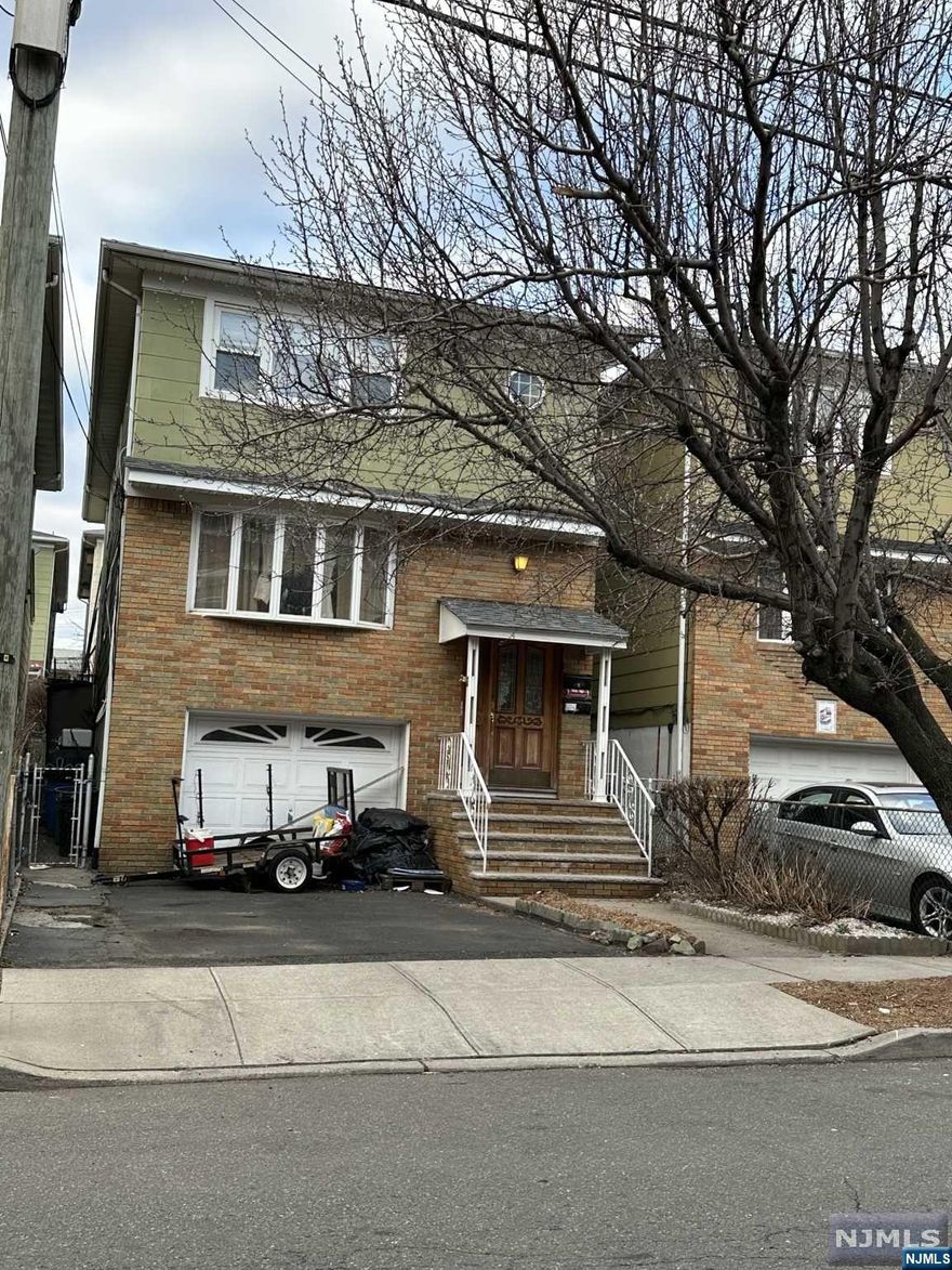 Welcome Home ! Beautiful 2 Family Home Conveniently located in Harrison .Walk to the PATH train and to all restaurants. Each floor boasts 3 bedrooms/2 bathrooms one en suite . Living Room, Eat in Kitchen. Finished basement/Rec Room with access to a lush enchanted garden with shed used as storage and/or a playhouse . Escape the bustle but stay close! 1/2 hr drive to NYC. Only 1 Stop to Newark , 5 stops to WTC. Make your appointments today