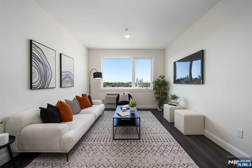 Welcome to your dream home! This brand-new 2-bedroom, 2-bathroom residence offers an impressive 1,105 sq. ft. of modern living space. The open floor plan is designed for contemporary living, featuring SS appliances, sleek shaker-style cabinets, and elegant quartz countertops in the kitchen. Enjoy the airy ambiance created by high ceilings, recessed lighting, and large windows in the living and dining areas, filling the space with natural light. The primary suite boasts a generous walk-in closet and a luxurious en suite spa-like bathroom, perfect for unwinding after a long day. Additional conveniences include one dedicated parking space. Residents can take advantage of elevator access and a shared roof deck, perfect for both relaxation and entertaining. Located just moments from Washington Park and the NJ Transit bus line to Port Authority, this home offers both comfort and convenience. Don't miss out on this incredible opportunity to own a piece of Union City!