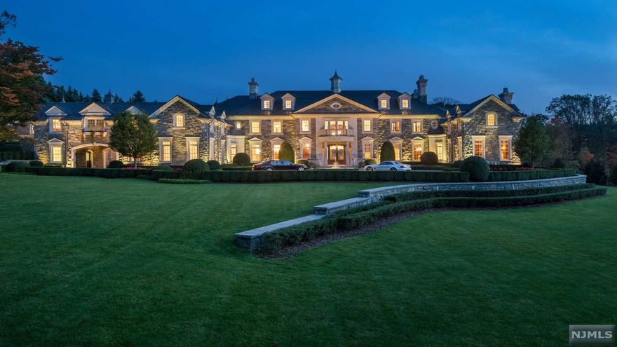 An American Masterpiece Loctated in one of the nations wealthiest zip codes, over 30,000 sq.ft. of luxurious living space only 8 miles from Manhattan. Reception rooms of grand scale proportions include a ballroom, martini parlor, his and her libraries, formal living room, formal dining room, north and south art galleries, and wine tasting room. 12 bedroom suites. Rare woods, stone, marble, and 12' high ceilings throughout. Elevator to all levels. Pool house w/kitchen, 65' saltwater gunite pool, and tennis court. Heated driveway, and gated motor court. Generator, fire suppression system, advanced security system, and smart house technology. Situated on 6 acres on the only guard gated St. in Alpine. Nothing quite like it. See floor-plan with photos.