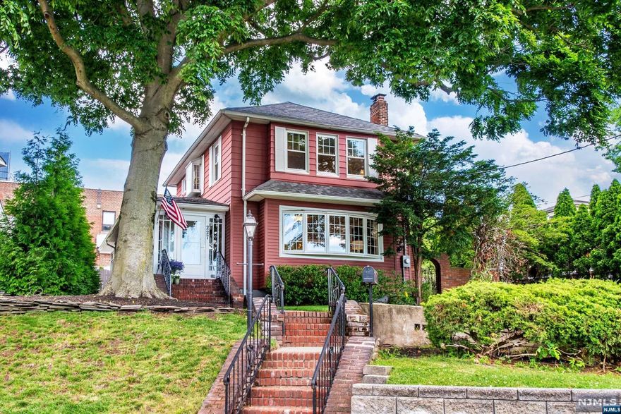 Welcome home! Cute as a button bright & spacious home that combines old world charm and modern conveniences. Spectacular skyline views from front porch, LR bay window and upstairs primary BR. Steps to NYC commuter bus. First floor with updated EIK kitchen, BR, DR, LR w/gas FP & built-in shelves, renovated full bath, washer/dryer and 3 season glass walled sunroom. 2nd flr with generous primary BR with custom walk-in closet, newer full bathroom and 3rd bedroom. Finished basement with half bath & den. Perfect for playroom or additional lounging and workout space. New CAC, oversized 2 car garage.