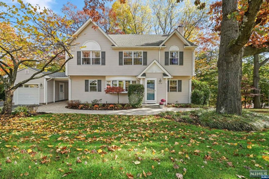 Experience the charm of Midland Park in this timeless four-bedroom, two full and two half-bath Colonial home. Embrace seamless indoor-outdoor living with a traditional layout that includes a formal living room, dining room, modern eat-in kitchen, family room with a wood-burning fireplace, home office, and powder room on the first floor. The oversized primary suite features a tray ceiling, walk-in closet, and a full bath, accompanied by three additional bedrooms and a main bath on the second level. The walk-out lower level hosts a game/recreation room, powder room, sunroom, laundry, workshop and utility space. An outdoor composite deck and private patio complete this wonderful package. Additional features include central air, a sprinkler system, 1-car detached garage, an exceptional neighborhood, top-notch schools, and a welcoming community. Your forever home is ready and waiting!