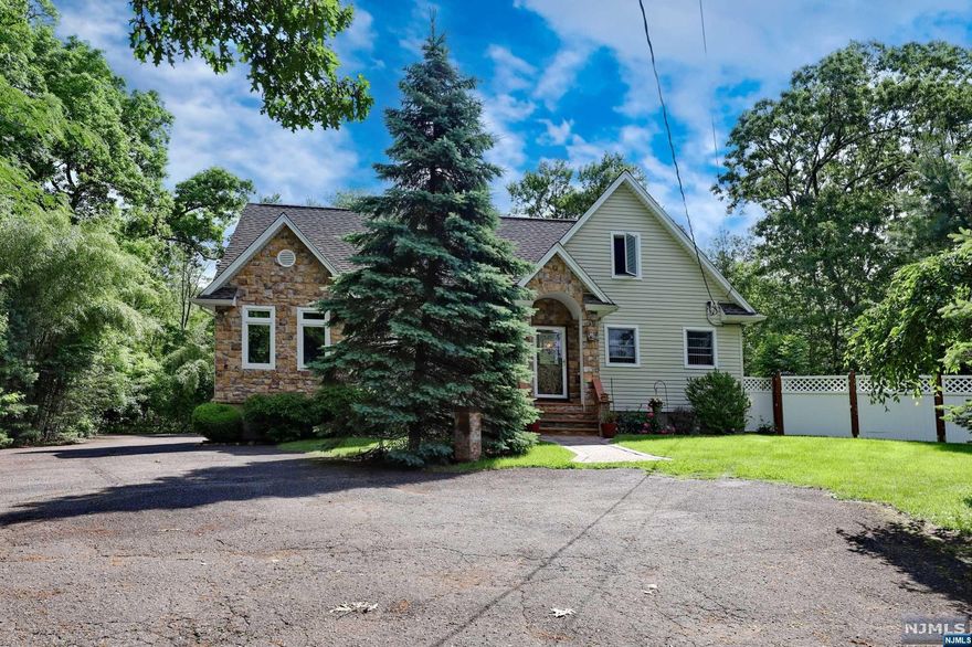 Welcome to this charming 3-bedroom, 2 bath home, open floor plan, updated kitchen, baths, windows, floors and much more, finished basement features recreation room, bathroom and sauna, great potential in second floor for more bedrooms ( addition of family room and second floor was done in 2009). This home is located on a cul-de-sac in a beautiful section of Wanaque. The kitchen is modern with center island and granite counter tops. The bright family room with the wood stove. Enjoy private patio with cover room for jacuzzi tub, fenced - in yard. With its convenient location you'll have easy access to nearby parks, schools, shopping centers, and transportation options for your daily commute.