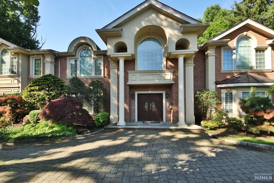 Magnificent Home. East hill of Tenafly. Colonial built in 2006 with top of the line materials. Gorgeous bright home on flat property. Beautiful all brick exterior. 2 Story Entry Foyer with stunning bridal staircase. Radiant heat on Marble flooring in Entry, Kitchen and Master Bath. Jacuzzi in MBth, overlooking large lush backyard. Each Bed Rm has sitting area, all crown moldings. Chef Kitchen with Viking appliances and lovely, sunny Breakfast area. Attached 3 car garage. Top ranked Tenafly schools. Minutes to Manhattan. Come tour this beautiful home today!