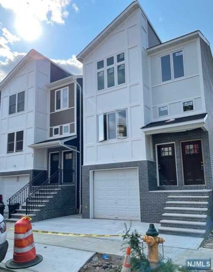 Fall In Love With This New Construction Two Family Home. 1st and 2nd Unit Features a Master Bedroom, that includes a Walk In Closet, Full Bathrooms, 2 Bedrooms, Main Bathroom, Kitchen, Open Large Concept Living/Dining Room. The Ground Level Features a Rec Room, Bedroom, with 1/2 Bathroom and Laundry Room. Property Qualifies for a 5 Year Tax Abatement and 10 Year of Home Warranty. Close to Major Hwys and Transportation. A Must See!