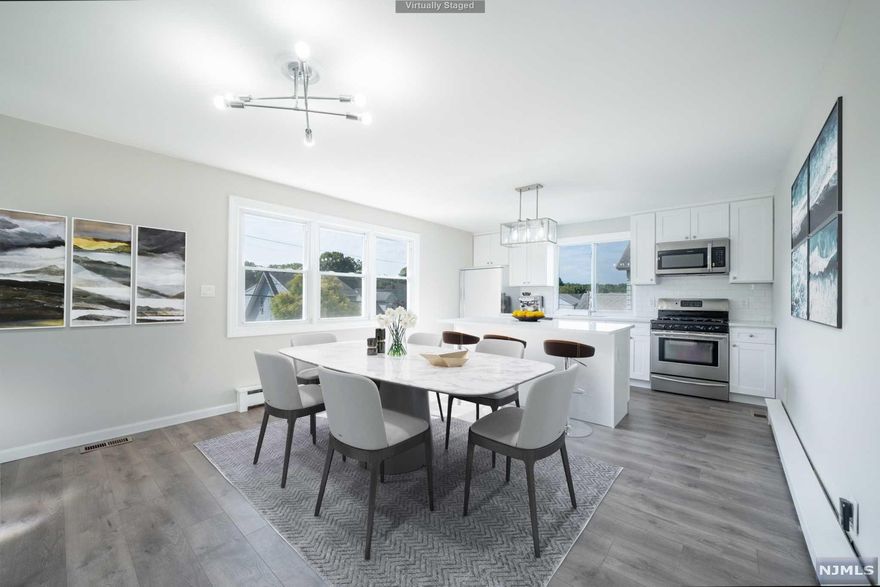 FULLY RENOVATED 4 bedroom, 2 full bathroom Colonial in the heart of Totowa! EVERYTHING BRAND NEW. Beautiful landscaping and plantings in the front of the home with a front deck to enjoy your views. Gorgeous Kitchen with Center Island, Quartz Countertops, and SS appliances, OPEN-CONCEPT to the dining area. Spacious living room plus 1st floor guest bedroom and full bathroom on the first level! Upstairs, find 3 spacious bedrooms and another full bath. The Primary Suite offers a walk-in closet and in-room laundry for your ultimate convenience. GREAT LOT SIZE THAT IS OVERSIZED... potential in the future to subdivide! Large paver patio area with a park-like property and amazing backyard. Unfinished basement plus 1 car attached garage. Unique offering of two driveways - can host multiple vehicles. The home has been completely updated with no expense spared, truly turn-key.