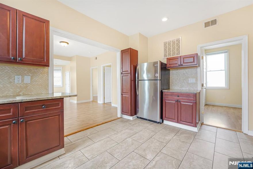 Step into unparalleled comfort and style with this expansive 3-bedroom, 1-bath second-floor apartment in the heart of Hawthorne, just a short walk from the serene Goffle Brook Park. This remarkable unit boasts an open-concept layout, flooded with natural light and showcasing gleaming laminate flooring throughout. The updated kitchen features granite countertops and stainless-steel appliances, providing both functionality and style. Enjoy year-round comfort with central HVAC, and take advantage of the bonus private balcony, perfect for enjoying the outdoors. Offering an abundance of space, this home is nestled on a quiet, desirable street, providing both tranquility and easy access to everything you needâ€”parks, shopping, dining, and transit. No pets allowed. Tenant responsible for the first $100 of any repairs. Donâ€™t miss the chance to live in this stunning, spacious home.