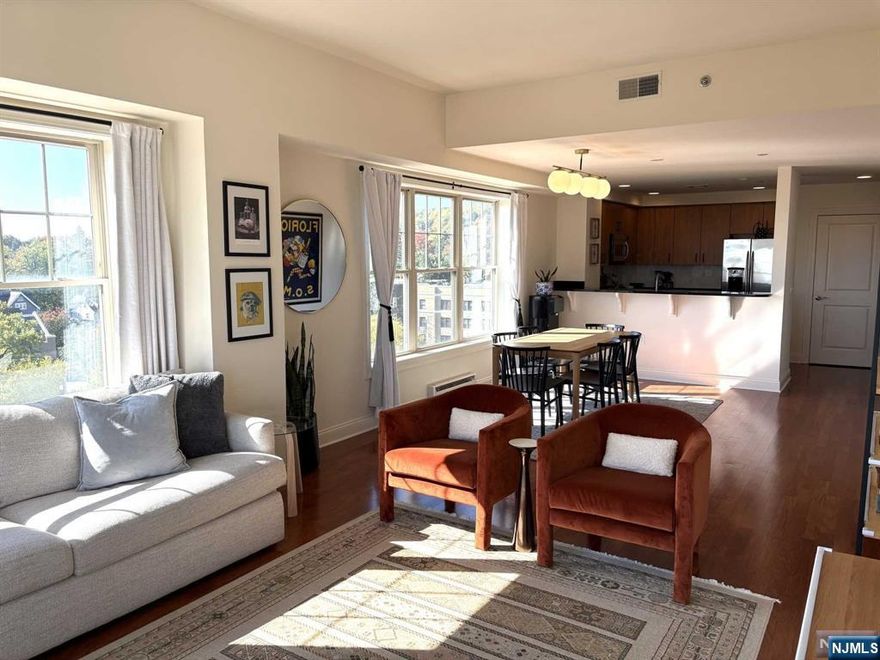 This is a one of a kind corner unit on the top floor with jaw dropping NYC views. Featuring 2 large bedrooms with walk-in closets and 2 full bathrooms. Oversized primary has a large en suite bathroom featuring a double vanity, soaking tub and walk-in shower. Spacious kitchen with large pantry opens up to a sun filled dining and living room, making it the perfect place for entertaining. Includes laundry in-unit and a deeded indoor garage space and storage unit. Wake up to the sunrise over NYC and then relax later to the sunset over Eagle Rock Reservation. The Siena is located in the heart of downtown Montclair, walking distance to restaurants, theaters, shops, cafes, nightlife, the train and more! The building also features a large communal roof deck with lounge and dining seating. This is a pet friendly, elevator building with a doorman. MORE PHOTOS COMING SOON!