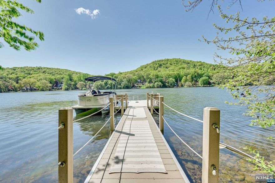 Explore The Elegance Of This Stunning 4 Bed Custom Home In Kampfe Lake, One Of The Most Pristine Lakes In NJ! Follow The Path To Your Front Door And Step Into The Bright Open Kitchen Complete With High-End Appliances, Such As An 8-Burner Double Oven Gas Range With Griddle & Kettle Faucet, And A Warming Drawer! The Open Living And Dining Area Features Large Windows That Bring In Natural Light And Magnificent Lake Views! Beautiful Floors Grace The 1st And 2nd Levels, Enhanced By High Ceilings! The 1st Floor Features A Den/Office/Bedroom, A Generous Walk-In Closet, A Powder Room, And A 5-Fix Bath With Stall Shower And Soaking Tub! Step Into The Screened Porch With Deck Access And A Gas Fireplace! Upstairs, Discover An Exercise Rm, 2 Spacious Bedrooms And A Primary With A Luxurious Bathroom That Includes A Stall Shower And Claw-Foot Soaking Tub! Unwind On Your Private Balcony And Savor The Scenic Views! The Lower Level Offers A Den, A Rec Room, A Pantry, Laundry Facilities, Another Fu