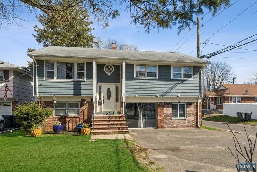 This 2 family on a corner lot in the heart of Bergenfield is a must see. Mature landscaping and large backyard on a 52X121 lot. 4+ Car Driveway. This property includes Central Heating. Plenty of light throughout both units. Top Unit #1 is a 3 Bed 1 Bath boasting wood floors and custom built-ins throughout the unit. Recently renovated kitchen features stainless steel appliances, garbage disposal and granite countertops. Washer/dryer in unit with additional storage space in the attic. Ground Level Unit #2 is a 3 Bed 1.5 Bath which includes an additional den/office space. New flooring throughout the unit with updated doors/moldings. Updated kitchen with stainless steel appliances and granite countertops.