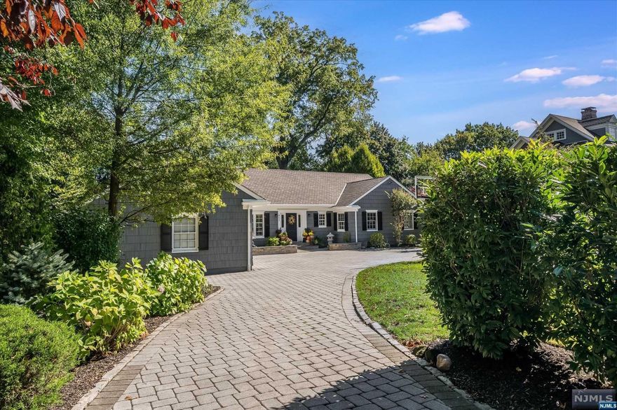 Beautifully appointed 5 bd, 4.1 bth raised ranch set in the heart of GR, on almost 1/2 an acre of landscaped resort-style property. The open floor plan includes a gourmet kitchen w/ high-end ss appliances, natural quartzite countertops & a lrg island. The 1st flr features a liv rm, formal din rm & a lrg family rm w/ built-in bookshelves & gas fp. 2 primary bedroom suites, 1 on ea flr, offer luxurious en-suite bth rms & wics. The lower level boasts a lrg rec rm, gym, sauna, full bath, & laundry. Step outside to enjoy the private outdoor oasis w/ an expansive patio, in-ground commercial ss Bradford hot tub, built-in gas grill, refrigerator & gas fp. Additional features include a 6 fps, 2-car attached garage, 4-zone heating and cooling, generator, sprinkler system, and landscape lighting & more. Conveniently located near Walnut St. train & village, GR top-rated schools. This home is a perfect blend of luxury & comfort.