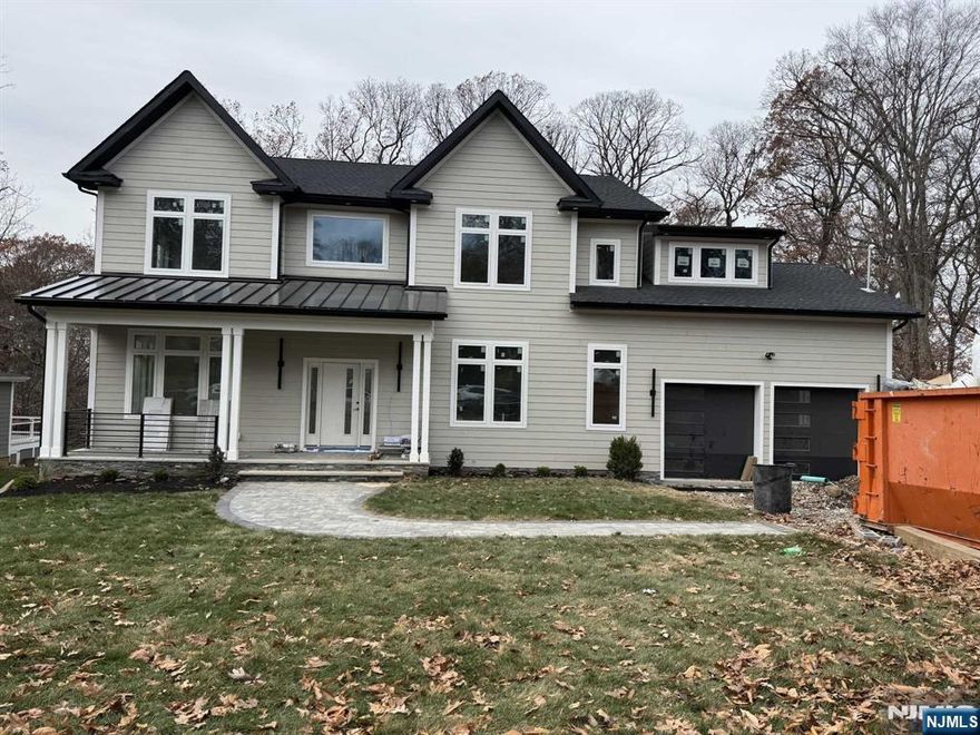 Welcome to this stunning NEW CONSTRUCTION colonial home, located in the desirable Broadlawn neighborhood on a quiet street. Set on 0.5 acres, this impressive 6-bedroom, 5.5-bathroom residence offers 5,200 sf of luxury across three levels. Inside, The gourmet eat-in kitchen is a chef's dream, featuring custom cabinetry, a spacious center island, high-end appliances, 48 build-in Refrigerator, quartz countertops, and a walk-in pantry. The family room flows seamlessly from the kitchen and includes an elegant electric fireplace and sliding doors leading to a large paver patio and expansive flat backyard ideal for entertaining. Modern smart home features and a 10yr reputable builder's warranty ensure peace of mind. Close to schools, major highways, parks and more.