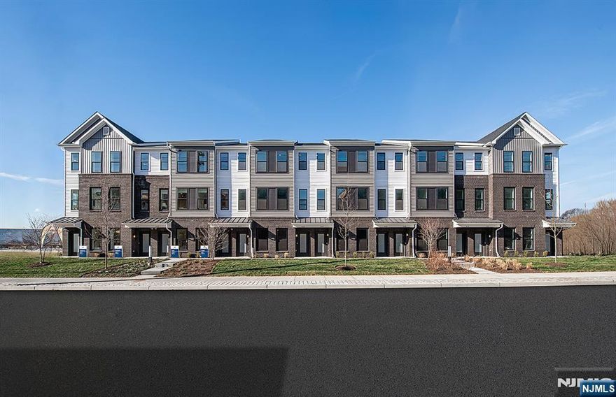 Discover a vibrant blend of comfort, style, and unbeatable connectivity at Bridgeview - a stunning new construction townhome community in commuter-friendly Kearny, NJ. Perfectly situated for effortless travel, Bridgeview offers immediate access to major highways, the PATH train to NYC, and Newark Liberty Airport-making it a prime location for busy professionals, hybrid commuters, and frequent flyers alike. This beautifully crafted Murray Hill end-unit townhome features 2 spacious bedrooms, 3 full bathrooms, and 1,238 square feet of thoughtfully designed living space. As an end unit, it offers additional windows, extra privacy, and enhanced natural light throughout. The open-concept layout is complemented by modern finishes, low-maintenance materials, and versatile spaces ideal for both relaxing and entertaining. Step outside and enjoy resort-style amenities, including a sparkling pool, fully-equipped fitness center, elegant club room, co-working lounges, outdoor grilling stations, dog runs, and a shuttle to the PATH train. Plus, you're just steps from all the conveniences of daily life-Starbucks, LA Fitness, ShopRite, Target, BJs, and countless restaurants and bars are all within walking distance. Whether you're seeking smart design, walkable convenience, or a lifestyle rooted in ease and access, the Murray Hill at Bridgeview delivers on all fronts.
