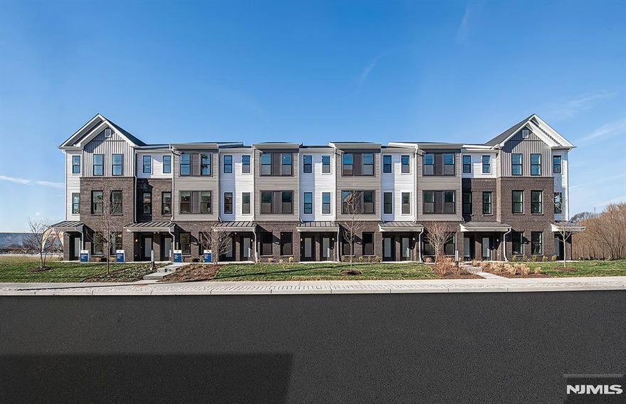 Discover a vibrant blend of comfort, style, and unbeatable connectivity at Bridgeview - a stunning new construction townhome community in commuter-friendly Kearny, NJ. Perfectly situated for effortless travel, Bridgeview offers immediate access to major highways, the PATH train to NYC, and Newark Liberty Airport-making it a prime location for busy professionals, hybrid commuters, and frequent flyers alike. This beautifully crafted Murray Hill end-unit townhome features 2 spacious bedrooms, 3 full bathrooms, and 1,238 square feet of thoughtfully designed living space. As an end unit, it offers additional windows, extra privacy, and enhanced natural light throughout. The open-concept layout is complemented by modern finishes, low-maintenance materials, and versatile spaces ideal for both relaxing and entertaining. Step outside and enjoy resort-style amenities, including a sparkling pool, fully-equipped fitness center, elegant club room, co-working lounges, outdoor grilling stations, dog runs, and a shuttle to the PATH train. Plus, you're just steps from all the conveniences of daily life-Starbucks, LA Fitness, ShopRite, Target, BJs, and countless restaurants and bars are all within walking distance. Whether you're seeking smart design, walkable convenience, or a lifestyle rooted in ease and access, the Murray Hill at Bridgeview delivers on all fronts.