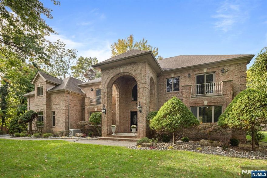 Sun-Filled Custom built Brick Center Hall Colonial located in East Hill. Large size of the lot, 26,136sf with the building size of approximately 6,153sf is a rare find and exceptional value in one of the most desired neighborhoods. Enter the premises along a dramatic radiant heated-porcelain tiled foyer opening into a double ceiling height reception area filled with gallery-quality natural light permeating through double windows in the living and family room. Gourmet kitchen boasts state-of-the-art appliances with a Quartzite countertop and back-splash along with a porcelain heated floor. Butlerâ€™s pantry leading to the large separate formal dining area, comfortably accommodates 10 -12-person seating overlooking at the outdoor forest. Spacious entertainment area featuring a fireplace with double ceiling height looking over beautifully landscaped backyard and oversized patio. Windows in living and family room letting in ample light whilst maintaining a cozy ambience, perfect as a library, music room or home office. Walking further in, find the generously-proportioned bedroom with a full bathroom which can be used for a guest or maid room. On the upper level magnificent master bedroom with sitting area, vaulted ceiling, walk-in closet. The seamlessly integrated master bathroom has a spa-like atmosphere. It is a true relaxation space. It enshrines a separate tub and toilet, double sinks and shower surrounded by a beautiful porcelain wall. Walk across the sky-bridge like hallway