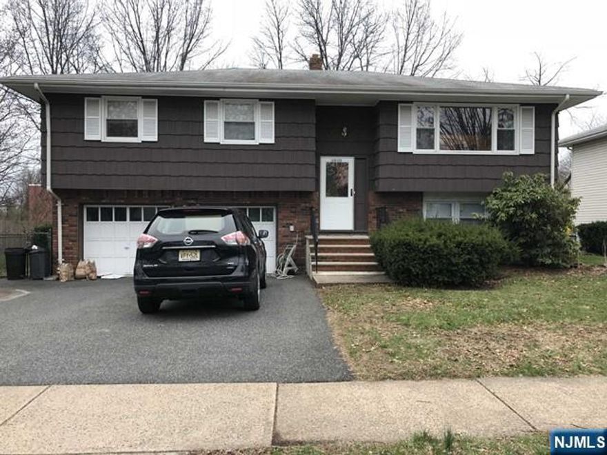 WELCOME TO THIS LRG BI LEVEL HOUSE THAT IS ON A QUIET STREET IN A WONDERFUL LOCATION! BEAUTIFUL HARDWOOD FLOORS THROUGHOUT THE SECOND FLOOR LEADING TO THE LR DR AND A SPACIOUS EAT IN KITCHEN. A FULL BATH AND 3 BEDROOMS INCLUDING THE PRIMARY BEDROOM WITH DOUBLE CLOSETS AND A FULL BATH CONCLUDE THE TOP FLOOR. THE HOUSE HAS A NICE FLOW, IT'S OPEN AND SPACIOUS. THE GROUND FLOOR OFFERS A FAMILY ROOM, A LARGE BEDROOM, LAUNDRY ROOM AND A FULL BATH, ENTRANCE TO A NICE SIZED FENCED IN BACK YARD. LOTS OF CLOSETS AND STORAGE SPACE. THIS HOUSE HAS A TWO CAR GARAGE, CLOSE TO SCHOOLS, PARKS, SHOPPING, TRANSPORTATION AND HOUSE OF WORSHIP.