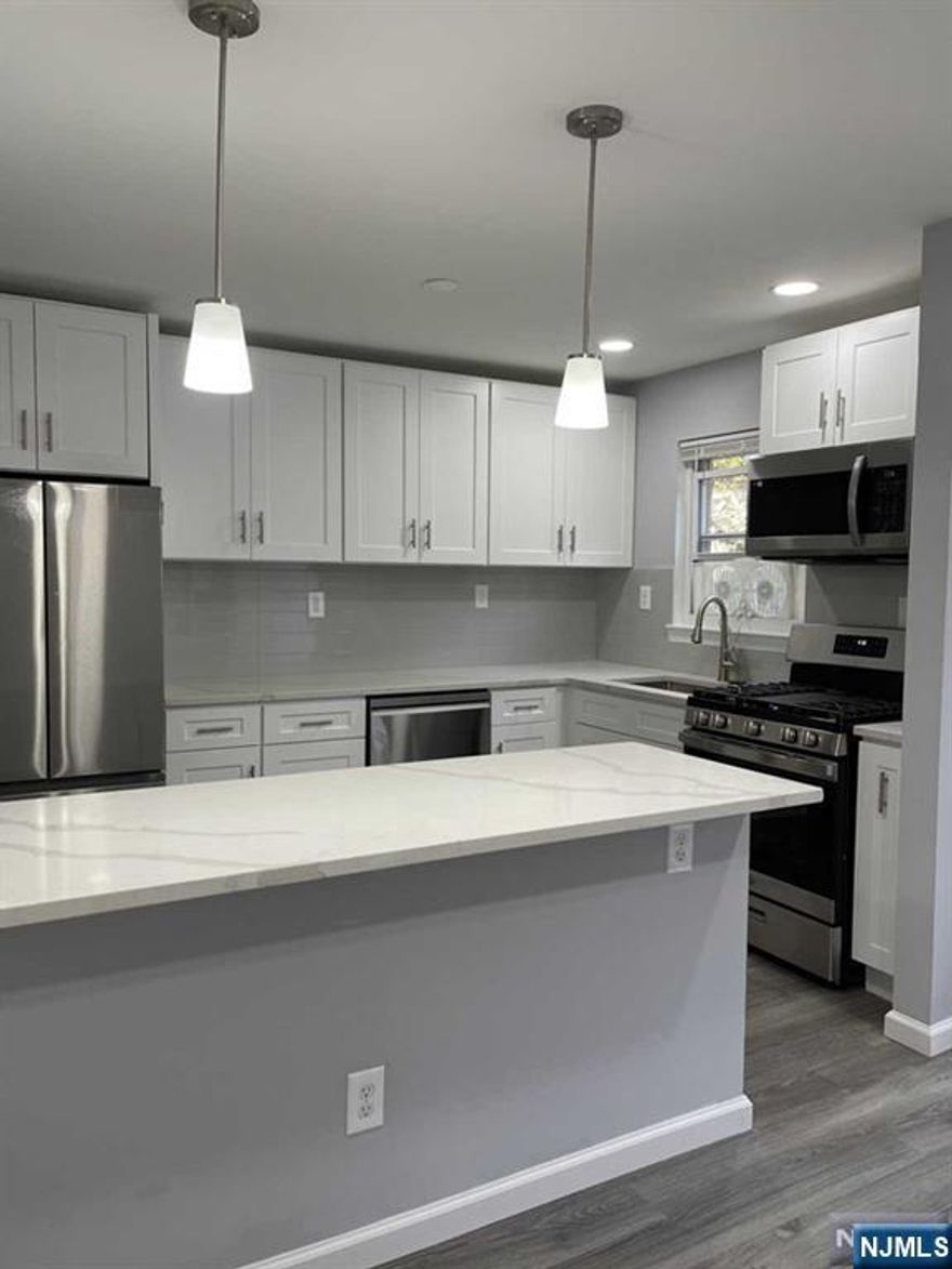 Totally Renovated(2023) 2 Bedrooms 1 Full Bathroom End Unit. New Kitchen with New Appliances, New Flooring, and New Full Bathroom. Very Quiet, Sunny, and Bright 1st Floor. 951 living sqft. Baseboard Heating, Hot Water and Parking are Included in the Rent. Close to Express NYC Bus, and School.