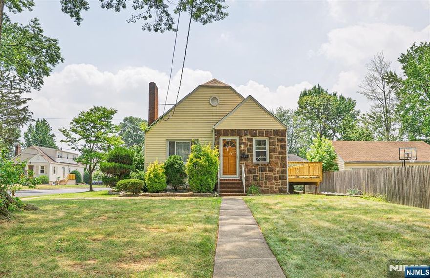 Welcome to 359 High Street, a charming cottage-style home nestled in the desirable Spring Garden section of Nutley. This lovely home features a spacious kitchen with ample cabinet storage and sliding glass doors that open onto the back deck, perfect for entertaining. The living room boasts beautiful hardwood floors, high ceilings, and a cozy wood-burning fireplace. The main bath is conveniently located on the first floor and includes a combined tub and shower. Also on the main level are two comfortable bedrooms, one of which offers stair access to a high-ceiling atticâ€”full of potential for future expansion or customization. A sun-drenched den with large windows, vaulted ceilings, and a private side entrance from Mapes Avenue provides an ideal space for relaxation or a home office. The finished basement offers even more living space, featuring new flooring, a French drain system, a half bath, two separate recreation rooms, a dedicated storage room, and a utility/laundry area. Outside, the driveway accommodates multiple vehicles and includes a convenient storage shed. Located just 13 miles from New York City, this home offers easy access to public transportation, major highways, and the ON3 Campus. Enjoy being close to Nutley's parks, schools, restaurants, and shoppingâ€”all within a vibrant and welcoming community. We invite you to experience all the warmth and potential this lovely Nutley home has to offer!