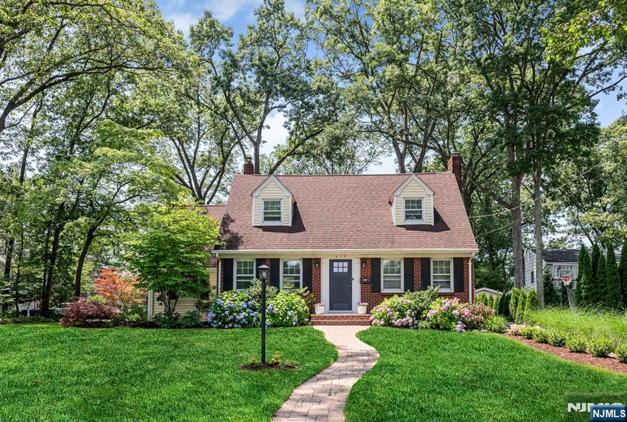 Welcome to this beautifully updated 3-bedroom, 2-bath colonial, nestled on a quiet corner lot with gorgeous new landscaping and standout curb appeal. Enjoy a newly renovated interior featuring refinished hardwood floors, complemented by a fresh coat of paint. Relax in the living room with a cozy wood burning fireplace. The kitchen boasts brand-new stainless steel appliances, a stylish new backsplash, and modern touches that make both everyday cooking and entertaining a breeze providing direct access to the dining room. The sun-filled great room features skylights, direct access to the paver patioâ€”perfect for seamless indoor/outdoor living. A full bath and new washer/dryer complete this level. Upstairs, youâ€™ll find a beautifully renovated full bath, with new custom window treatments and updated interior door hardware adding a fresh, designer feel throughout. The finished basement provides additional living space, storage, and dedicated space for a gym or home office. A new front door, new central air conditioning, 1-car garage, irrigation system, public water and sewer, and a long list of updates round out this turn-key home. Classic charm meets modern comfortâ€”this oneâ€™s a must-see!