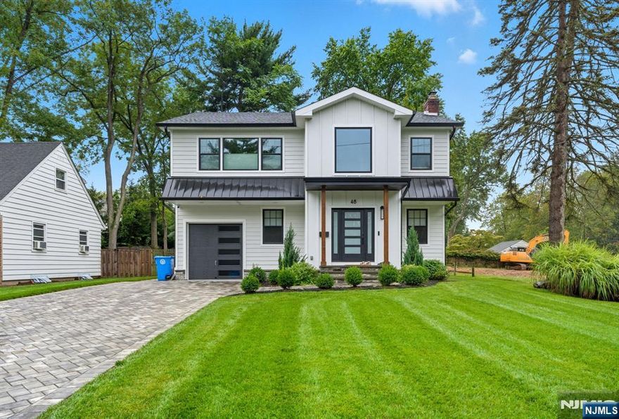 Beautiful one-year-old construction set on one of Tenaflyâ€™s most desirable streets, just a short walk to the elementary school, downtown, and NYC bus. This modern home offers an open floor plan, soaring ceilings, and abundant natural light throughout. The main level features a family room with fireplace, elegant dining room, top-of-the-line kitchen with breakfast area, mudroom, full bath, and a guest bedroom/office. Upstairs, the luxurious primary suite includes a walk-in closet and spa-like bath. Three additional bedrooms complete the floorâ€”two share a Jack & Jill bath while one enjoys a private bath. The finished lower level offers a large recreation area, ample storage, and versatility for todayâ€™s lifestyle. A stunning backyard provides the perfect setting for entertaining and play. Bright, stylish, and move-in readyâ€”this Tenafly gem is truly a must-see!