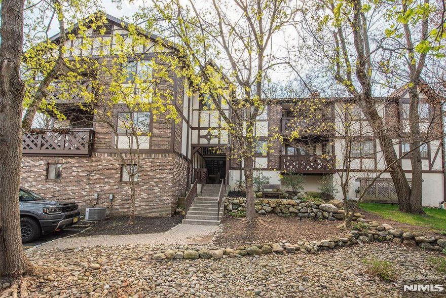 Rare and one of the Largest 1 bedroom models in Ridge Gardens,, this updated unit boasts Gleaming hardwood floors which greet you as you enter the foyer to the living room and formal dining room which is open to the kitchen. This sunny condo boasts an updated kitchen with stone countertops, SS appliances and breakfast bar for casual dining. Commune with your guests as you prepare a gourmet meal. King size bedroom boasts walk in closet. Updated full bath with walk-in shower is warm and cozy. Full size washer & dryer with storage. Private balcony for outdoor living completes this beauty. Caged and locked storage in the building. Ridge Gardens is like being in the English countryside. Paver walkways to meet your neighbors as you walk, jog, bike or take your dog out for exercise. Refreshing pool for summer fun, tennis and picklelball courts for the sports enthusiast. NYC bus stop just outside the entrance. Close to schools, library, shopping and transportation. A fabulous lifestyle.