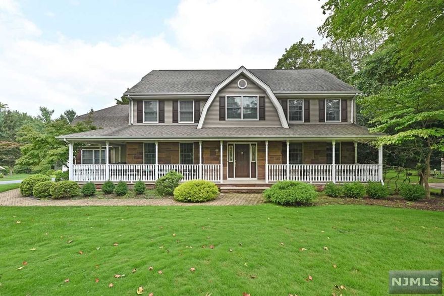 Prime Northern River Vale Location! This Grand, Stately, Impressive Farm House Colonial offers an exceptional setting in Million Dollar Plus Neighborhood with Inviting Wrap Around Front Porch. Approx Half Acre 120 x 175 of Gorgeous Grounds/Fully Fenced Yard. Granite kitchen offers breakfast island, stainless steel appliances and large dining area that opens to the family room with wood burning fireplace, sliding glass door to large deck overlooks the immense and beautiful private property. Primary bedroom offers walk-in closet & primary bath with shower stall, tub & double sinks, 3 additional large bedrooms and full bath w/double sinks. Fully finished basement offers large recreation room, office and utility room with plenty of storage. Features include custom mill work, hardwood flooring, 2020 central air conditioning, 5 zone baseboard heating, updated driveway, sprinkler system. This is truly a magnificent home and location!