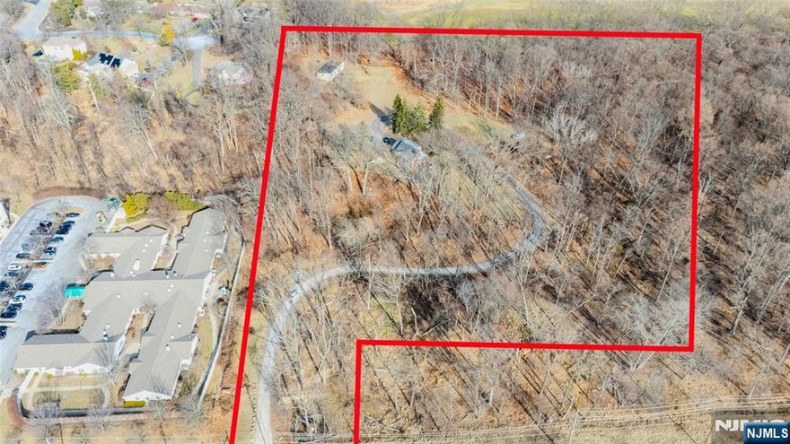 Ideally located and set back from Hamburg Tpke, this 5.77 acre parcel is prime for development. Site currently consists of a single family home, and an outbuilding with a large open cleared area. R-30 zoning. Subject to approval deals considered. Great opportunity to develop this parcel and join neighbors McDonald's, Wendy's, Retro Fitness and more!