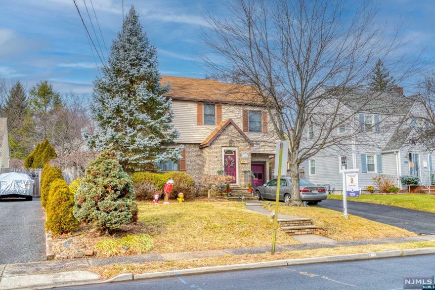 Welcome to this classic 3 bedroom, 2 full bath brick and vinyl home located near shopping, restaurants, and NYC transportation in top location! The first floor features an entry foyer, living room, hardwood floors and modern kitchen and a bonus den. The second floor features 3 bedrooms and a full bath. Other amenities include an attached garage, central air. Enjoy the seasons in the fenced in yard with patio.