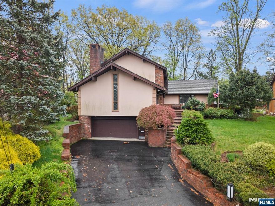 Step into a custom-built home that blends everyday comfort with standout design. A dramatic two-story foyer welcomes you, highlighted by a sweeping staircase that creates an immediate sense of elegance. The formal living room features a soaring cathedral ceiling with exposed wood beams and an original brass fireplace, adding warmth and timeless character. A formal dining room provides the perfect setting for gatherings and special occasions.At the heart of the home is a renovated eat-in kitchen with cherry wood cabinetry, Viking stainless steel appliances, granite countertops, and a large center island with a breakfast bar. A separate dining area overlooks the backyard, filling the space with natural light. Each bedroom is designed as a private suite with its own full bathroom, offering comfort and privacy.Upstairs, the main primary suite includes a walk-in closet with custom built-ins and a spacious bath. A loft area offers flexibility for a home office or lounge. The finished basement features a kitchenette, full bath, media room, laundry, and a separate entrance. A wide driveway leads to a two-car garage. The backyard offers private outdoor space with patios and mature landscaping, perfect for relaxing or entertaining.