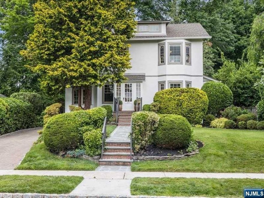 This beautiful 4 BR, 2.1 BA Col has been freshly painted in & out & is picture perfect. Located on a gorgeous property in a prime Upper Montclair neighborhood between Watchung Plaza & Upper Montclair Village, there's easy access to NYC trains & bus, shopping, dining, schools & 3 parks. Inside the 1st floor encompasses a LR w/fireplace, formal DR, SR, kitchen, PR & large family room/breakfast room w/ access to the yard and patio. The kitchen features ss appliances, granite counters & ample cabinet/closets. The 2nd floor offers 3 BRs & full BA with an additional BR & storage on the 3rd floor. The finished basement has a 2nd full BA, laundry, rec room area & lots of storage. Many recent updates include new water heater, refinished sugar pine floors, new doors and trim, electrical outlets & switches, new skylights & light fixtures. Fresh lush landscaping. Newer roof & windows. Underground sprinkler system. Paver driveway and patio, blue stone front walkway. Outdoor built-in grill.