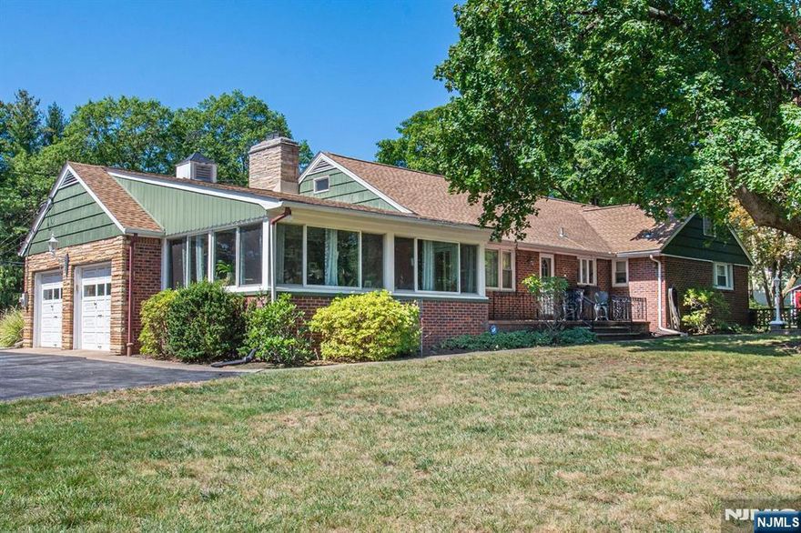 Your dream home awaits you. Situated on almost an acre of park-like property this 3 BR / 2.5 BTH Ranch is sure to impress the most discerning buyer. Step inside to a welcoming entry foyer. Sun-filled hardwood floors flow seamlessly into the Living Room and banquet-sized Dining Room, where the fireplace serves as the main focal point. Next, imagine preparing your favorite dish in the Modern Eat-In Kitchen featuring quartz countertops while your guests enjoy a glass of wine in the Sun Room overlooking the yard. From here, retreat to the spacious primary suite featuring a walk-in closet and a private ensuite bath. Two additional bedrooms with ample closet space, a Full Bath, and convenient access to the attached 2-Car Garage complete the main floor. The lower level features a spacious Recreation Room, Half Bath, Bonus Room, Summer Kitchen, Laundry/Utility Room & storage closet. Whether you envision a Home Theatre, Gym, Office, or extended living space, the possibilities are endless. The perfectly manicured backyard offers your very own oasis and an exceptional space for entertaining. Appreciate all that living in Norwood affords you including access to top-rated Northern Valley schools, parks, restaurants, shopping, and an EZ commute to NYC.