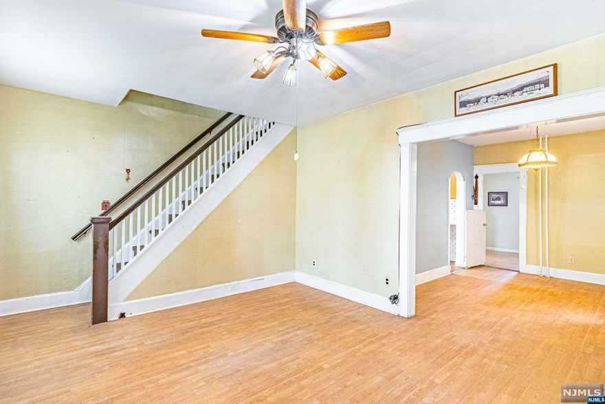 A Commuters Delight....A One Minute Walk to the Stop for 3 NYC Buses. This Charming Colonial is Centrally Located in East Rutherford. A Side Stairwell allows for easy flow from Living Room to Dining Room into the Kitchen. Additionaly on the Main floor is Room to be used as an Office or Bedroom with Connecting Full Bathroom. The 2nd Floor with 2 Bedroom and a Full Bathroom. The Basement Level with Laundry, toilet and Open Space can be easily finished....Come see this Great Opportunity and Benefit from the Low Taxes in East Rutherford!