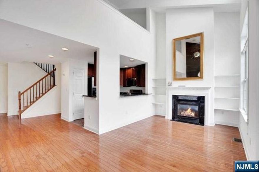 Spectacular South facing Chatham style townhome! This 1762 Sq ft freshly painted townhouse boasts of Two bedrooms, two full baths and a half bath ,a spacious loft area that is ideal for a home office/ home gym or even a third bedroom.The living room has high ceilings with double pane windows which flood the home with sunlight.The home comes with a Gas Fireplace marble surround and custom shelving.The kitchen has granite countertops & stainless steel appliances.The spacious loft overlooks the living room .The Laundry room is conveniently located on the same level as the bedrooms. The Master bedroom has high vaulted ceilings a spacious Master bathroom and massive walk-in closet. The townhome comes with two Parking spaces. The Community features two pools with Jacuzzis, a tot lot,the impressive waterfront promenade and free Ferry bus that runs the NY Waterways ferry terminal and light rail. The community is conveniently located close to Shopping , Stores & Restaurants.