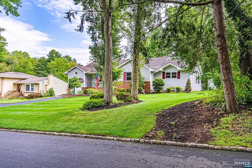 This beautiful split level home in a sought after neighborhood checks all the boxes. Cathedral ceilings, hardwood floors, recessed lighting, skylights, crown molding, granite counters, stone/glass backsplash, tumbled marble tile floor. All meticulously maintained. Lots of Generous Room Sizes to Spread Out & Make Your Own! You will be sold the moment you walk through the front door. Bright space w/oversized front window and brick corner, floor to ceiling fireplace. Formal dining conveniently located off the updated gourmet kitchen equipped w/41 cabinets, chef grade appliances, breakfast bar, pantry, wine fridge and butler's pantry. 2nd floor hosts a primary suite with jetted tub and stall shower & 2 additional bedrooms and full bath. Optional 4th bedroom or office on ground level along with half bath, exercise room and large family room with gas fireplace. Walk out to the backyard!