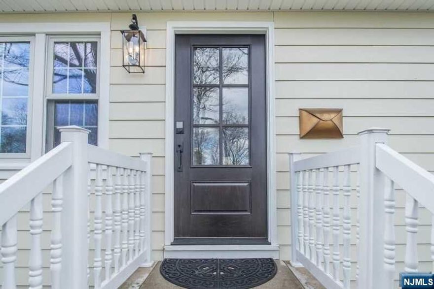 Welcome to this beautiful three bedroom/two bath ranch. LR,DR,Updated Kitchen w/Breakfast Bar, Subway tile, Bosch DW,Refrigerator & Microwave,Double Oven, Granite Counter,Wine Frig. Family Room w/Built-Ins, Vaulted Ceiling, Skylight & Door to Deck & Level Rear Fenced-In Yard with mountain views. Renovated CTB w/Double Sink & Exposed Brick. Primary Bedroom w/Renovated Bath w/SS. Two additional bedrooms. Hardwood floors throughout even in FR, Interior Door & Hardware replaced. Recessed Lighting, Replacement windows, Crown molding, Levolor Blinds, Built-in speakers, Double wide driveway, attached garage. Renovated basement w/additional living space, laundry, storage, mud room entry to one car attached garage. Newer Central Air! Newer Roof. Part of RML $65 annually