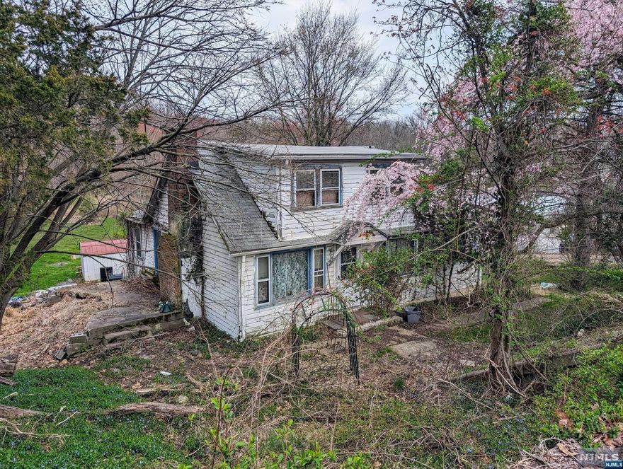 Amazing opportunity to make your dream home a reality! This 3-bed, 2-bath house is ready for new owners. With a large lot, it boasts low taxes and a prime location! Possible mixed use, please call the town for possibilities.