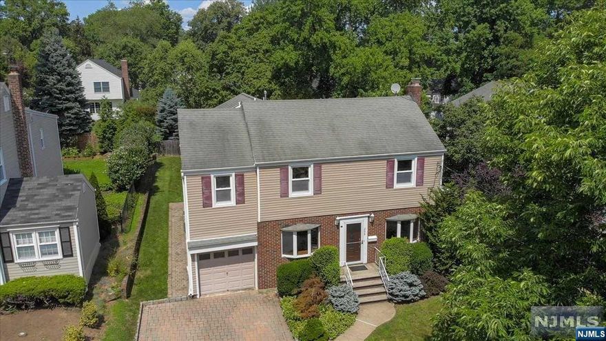 Welcome to this recently updated, expansive colonial home in River Edge, located in the heart of a top-rated school district and conveniently close to Van Saun Park. This well-maintained property boasts a generous 2,320 square feet of living space, making it perfect for families seeking ample room to grow and entertain. Step inside and be greeted by a new custom painted interior. Newly restored oakwood floors throughout the house add charm and character to each room. With 4 bedrooms, 2 and a half baths, there is plenty of space for everyone to enjoy their own private retreat. The kitchen features stainless steel appliances, granite countertops, and a cozy breakfast nook, perfect for casual meals with loved ones. There is a formal dining room for family meals. The living room and family room provide ample space for relaxation and entertainment, highlighted by a cozy fireplace. For those in need of a private workspace, a dedicated home office awaits.