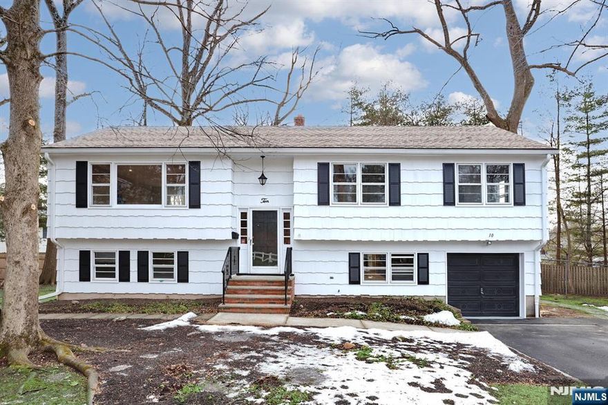 Nothing to do but move right into this updated bi-level on a quiet culdesac! This home has been professionally painted inside and out, brand new kitchen AND bathrooms! Step right into this newly renovated bi-level! Upstairs you'll find gorgeous hardwood floors, a brand new crisp white kitchen with access to the newly power-washed and stained deck. Just down the hall is the beautiful bathroom with tub, primary bedroom with WIC, a second BR with double closets, as well as a 3rd BR. On the ground floor is a very large family room, the fourth bedroom, a 2nd brand new full bath, an office/mudroom, laundry and acces to the attached garage. The spacious yard is perfect for the warm weather just around the corner this spring! Perfect for extended families! Don't miss out on this one!