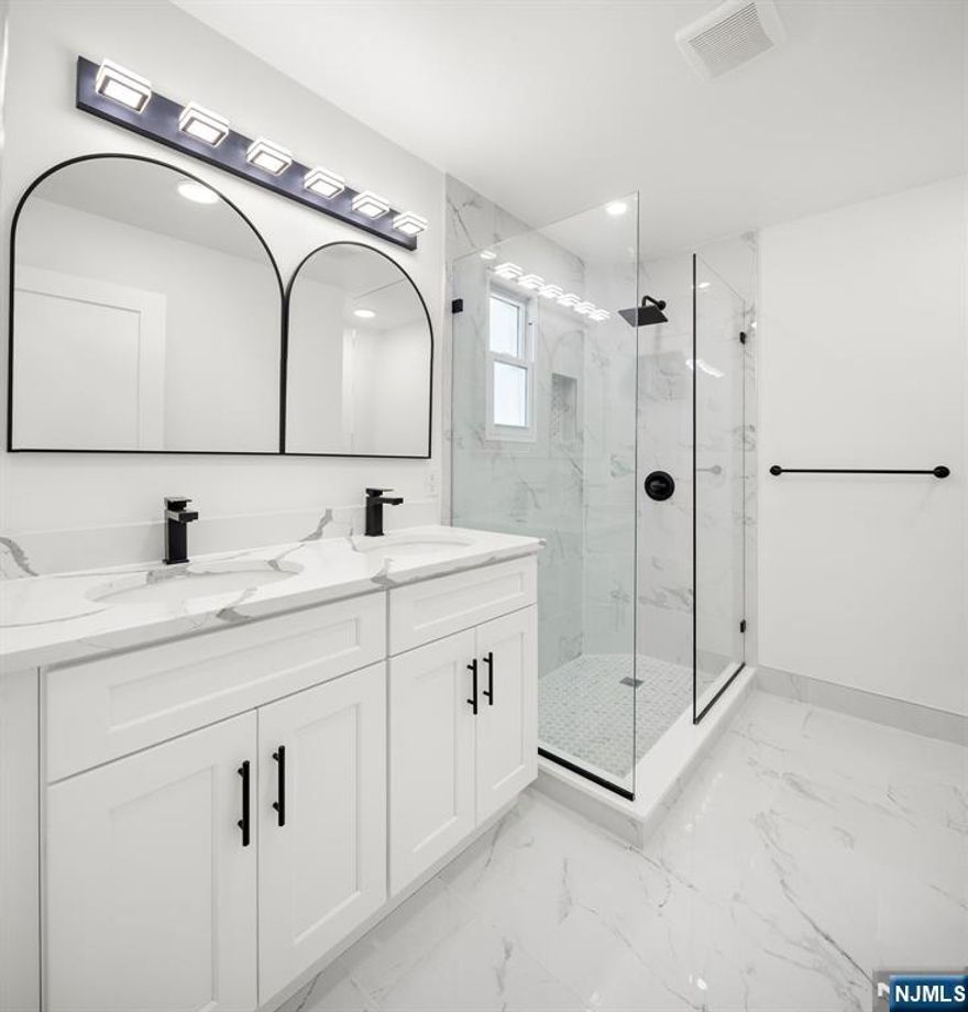 Welcome to this stunning, fully redesigned 4-bedroom, 2-bathroom single-family home complete with a bonus basement 1-bedroom unit, perfect for rental income, guest accommodations, or flexible use to suit your needs. Every inch has been reimagined with modern finishes, an open-concept layout, and sleek fixtures for a fresh, contemporary feel. The modern kitchen boasts premium cabinetry, stylish countertops, and stainless steel appliances, flowing seamlessly into the dining and living areas ideal for entertaining. Hardwood floors run throughout the home, adding warmth and elegance, while split-unit air conditioning on both the main and second floors ensures year-round comfort. The fully finished attic provides extra living space or a private retreat, and the spacious closets throughout the home offer ample storage. Step outside to your private backyard with a deck, perfect for relaxing or hosting gatherings, all surrounded by a beautifully landscaped setting.